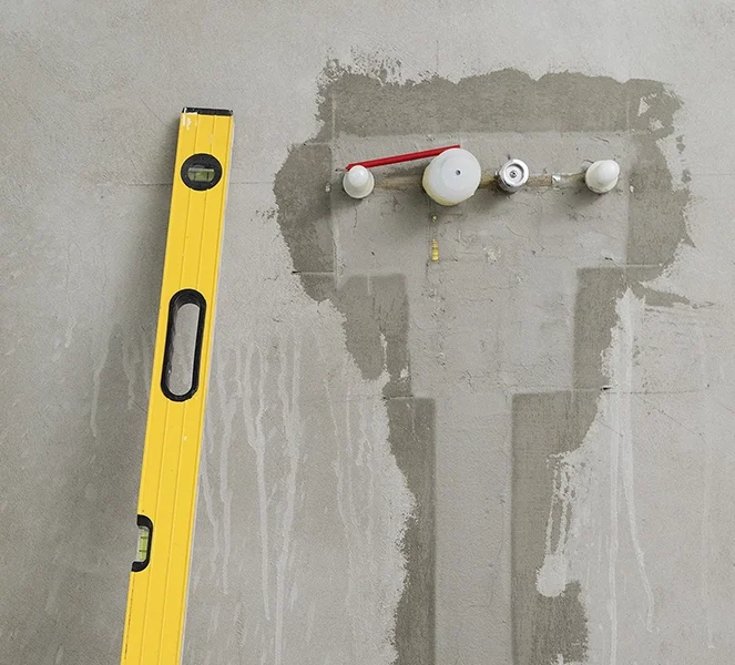Wall leveling and prep work during drywall services Aurora by Express Drywall Services.