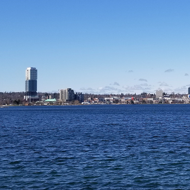 City skyline of Barrie viewed from the waterfront, served by drywall services Barrie from Express Drywall Services.