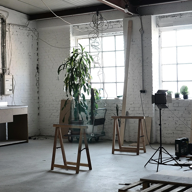 Room with unfinished walls and exposed windows needing insulation installation by Express Drywall Services.