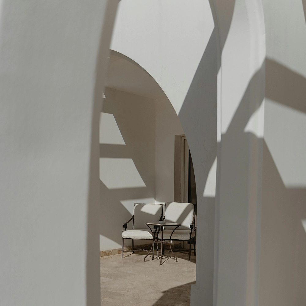 Outdoor space with curved custom archways by Express Drywall Services