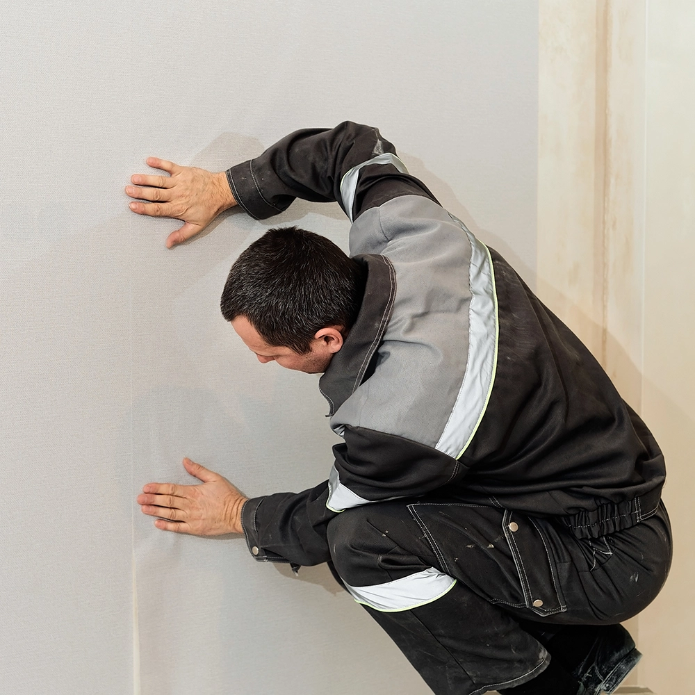 Express Drywall Services technician performing precise taping and mudding during a residential drywall finishing project.