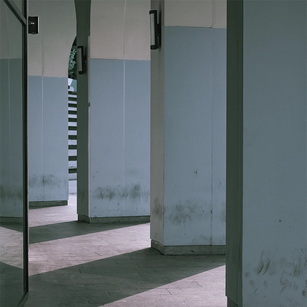 Exterior columns and passageway with exposed surfaces prepared for commercial framing by Express Drywall Services.