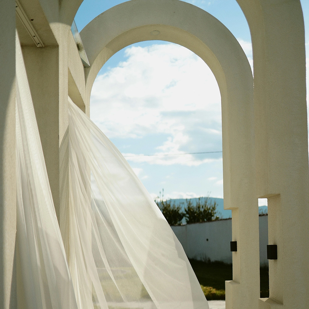 Exterior structure featuring curved commercial custom archways and designs by Express Drywall Services.