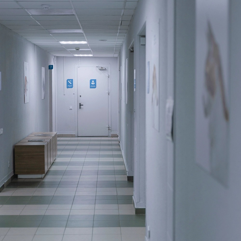 Fire caulking in a healthcare facility hallway performed to meet fire safety compliance.