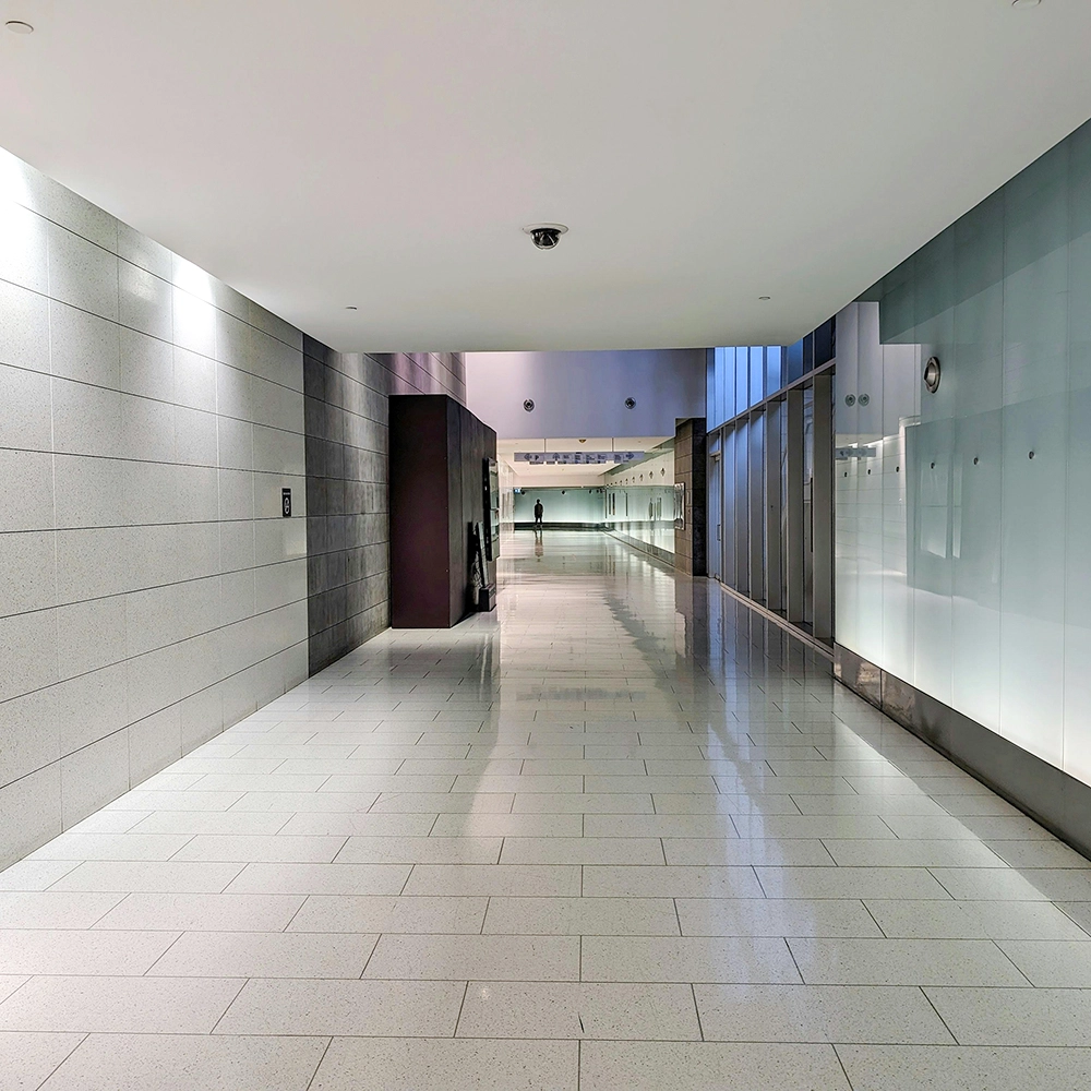 FRP installation in commercial passageway with high-durability wall cladding by Express Drywall Services.