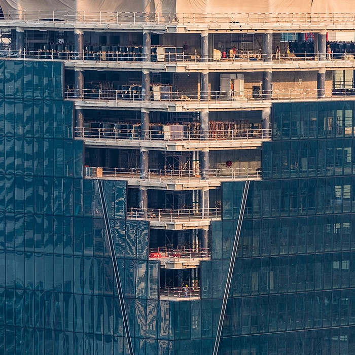High-rise construction showing floors prepped for commercial fire and sound separation by Express Drywall Services