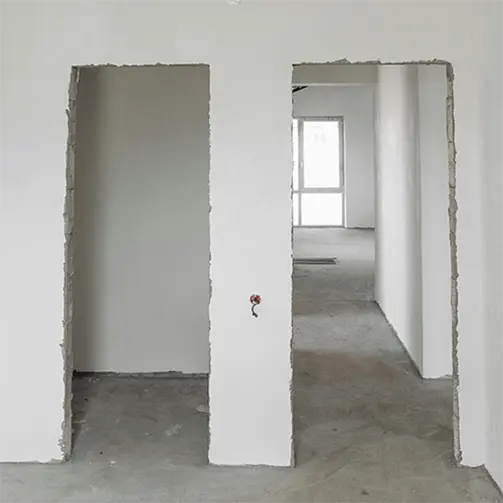Drywall framing prepared for future access door installation by Express Drywall Services.