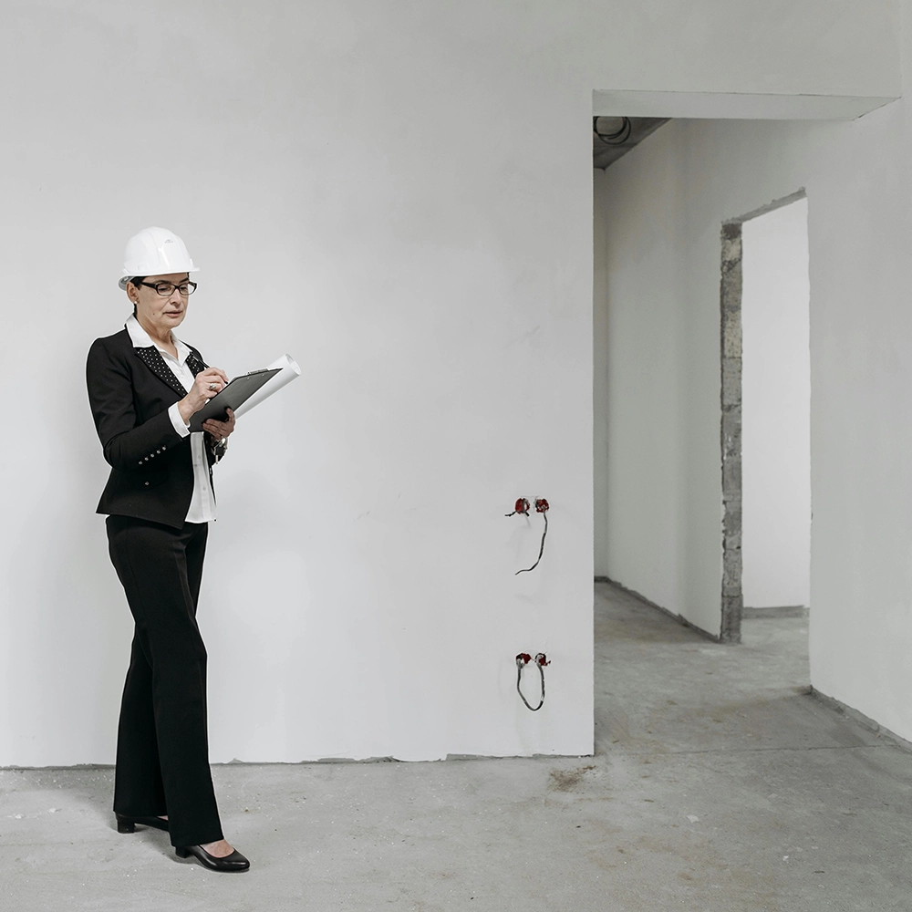 Commercial metal door installation in progress during a site inspection by Express Drywall Services.