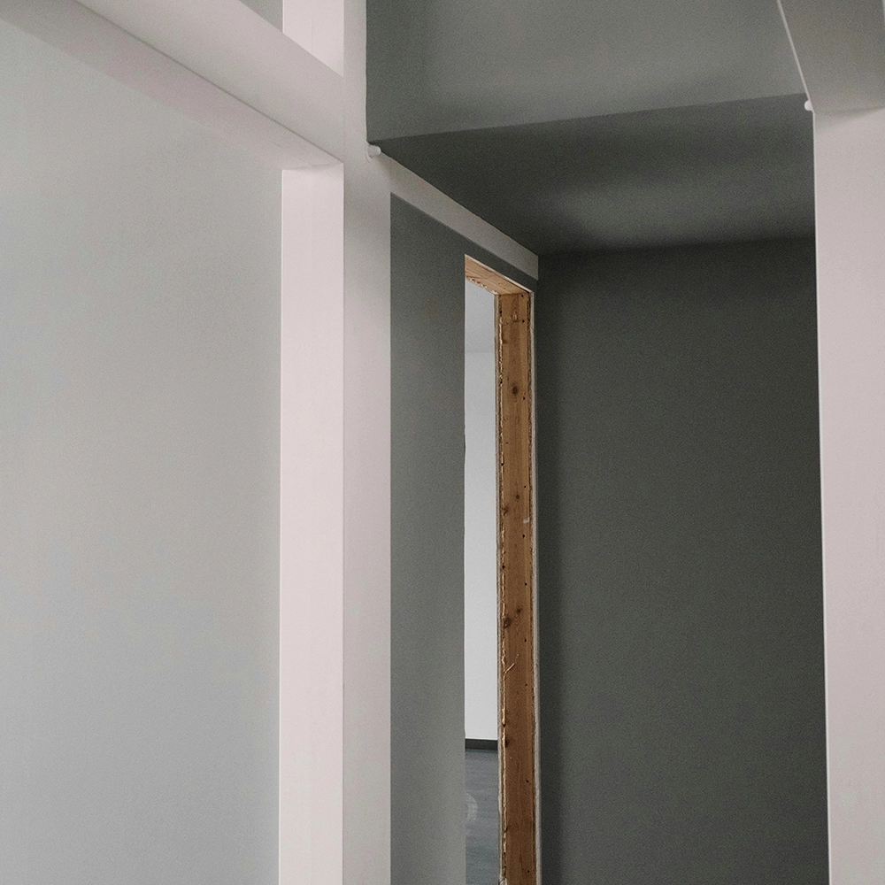 Interior hallway of newly constructed home post-insulation installation by Express Drywall Services.