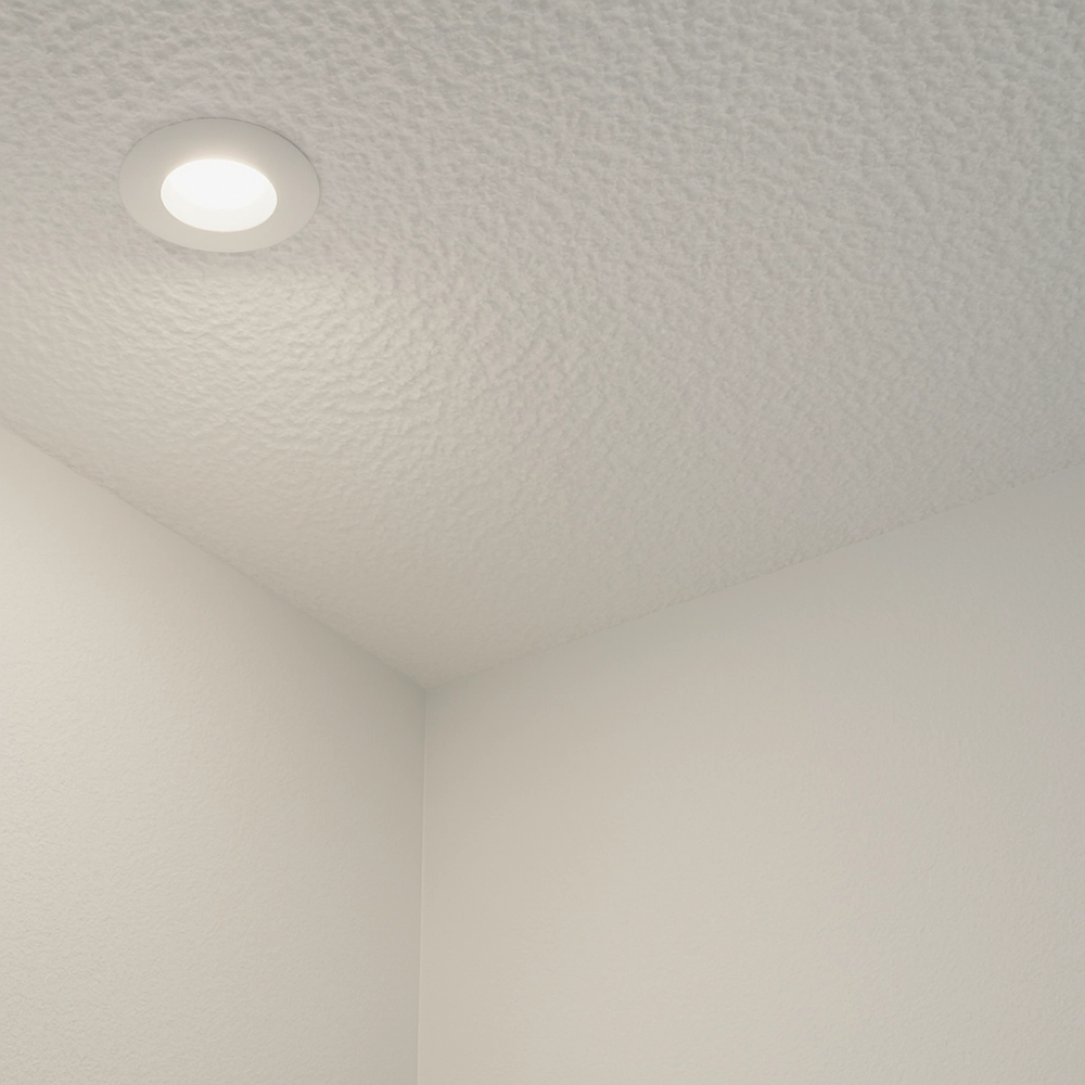 Close-up of textured ceiling with poor light reflection before popcorn ceiling removal by Express Drywall Services