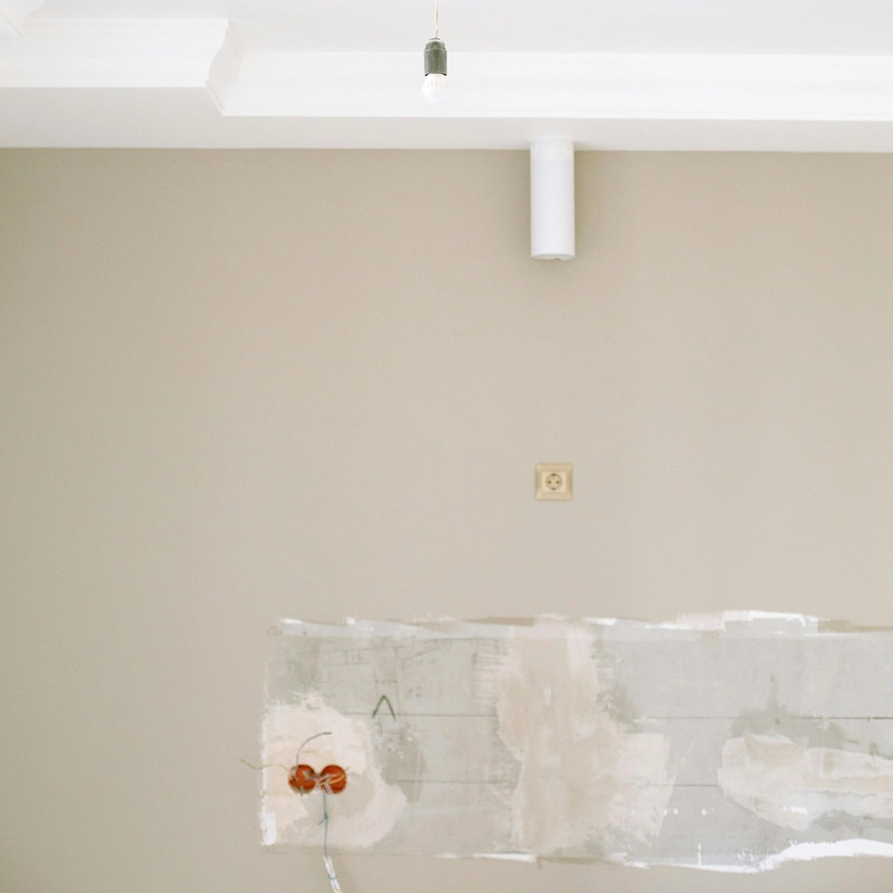 Electrical outlet area prepared for drywall repair by Express Drywall Services