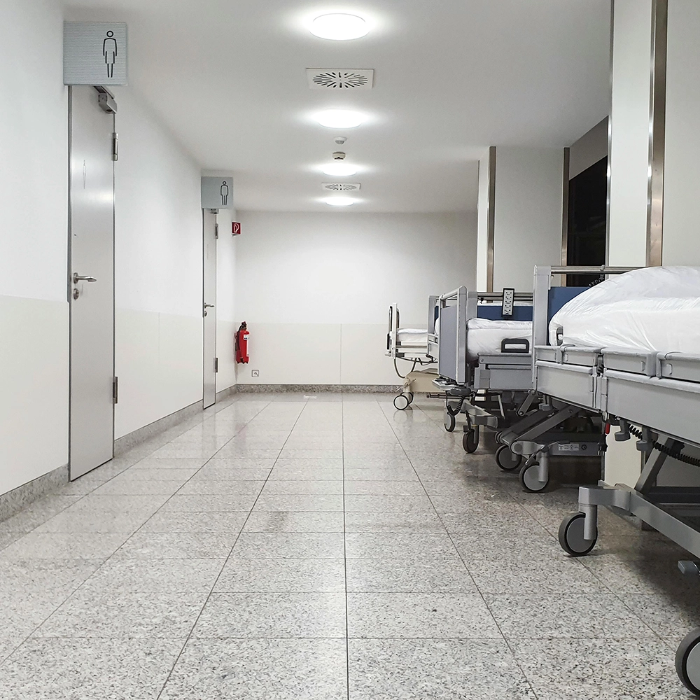 Resilient channel installation for acoustic separation in healthcare facility corridors.