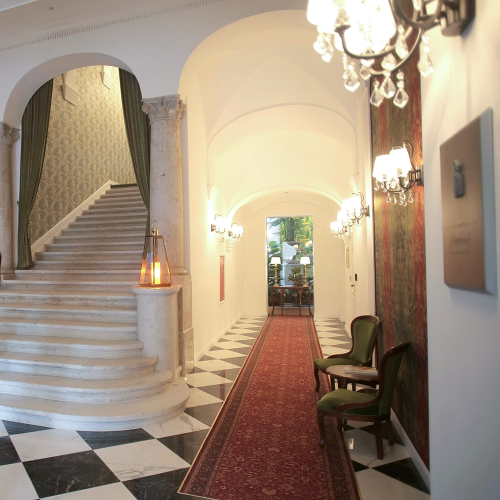 Stairwell with custom archways in hospitality by Express Drywall Services