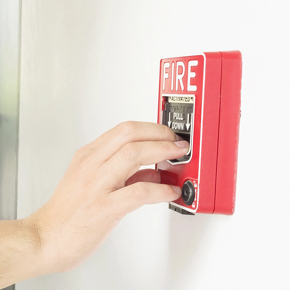 Fire caulking ensures code-ready firestop protection near emergency pull stations.