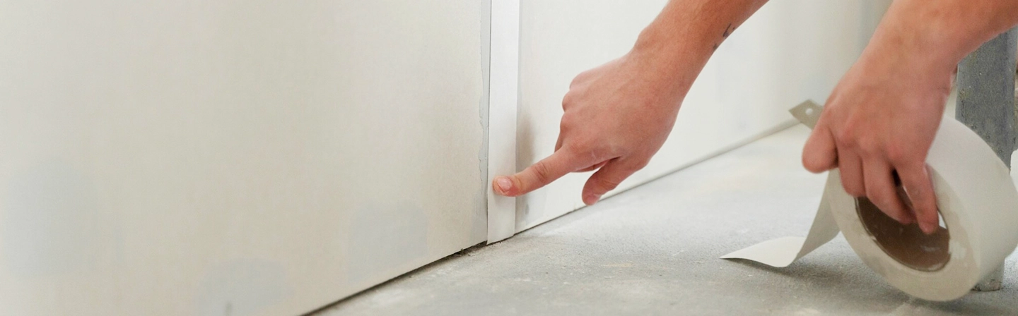 Drywall joint taping in progress during residential taping and mudding by Express Drywall Services.