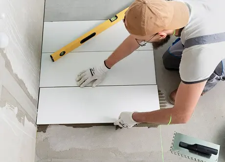 Floor tiling during moisture-resistant drywall installation and tile backer by Express Drywall Services
