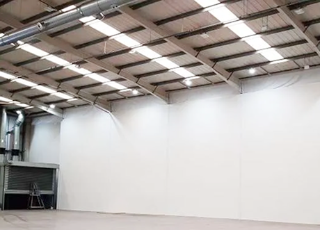 Tall fire and sound separation wall by Express Drywall Services