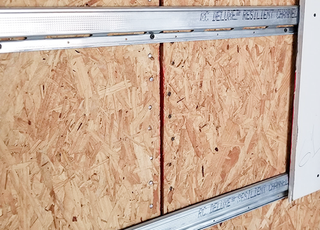 Detail of resilient channel installation on OSB sheathing