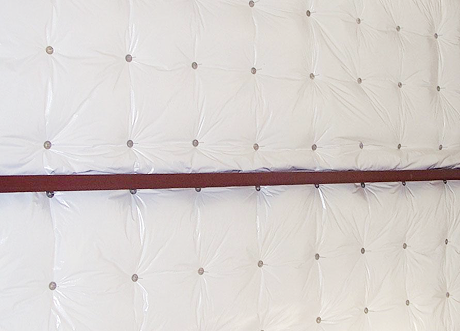 Commercial insulation installation and stickpin insulation by Express Drywall Services on interior wall surface.