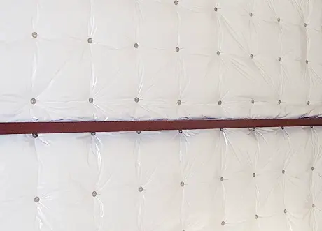 Commercial insulation installation and stickpin insulation by Express Drywall Services on interior wall surface.