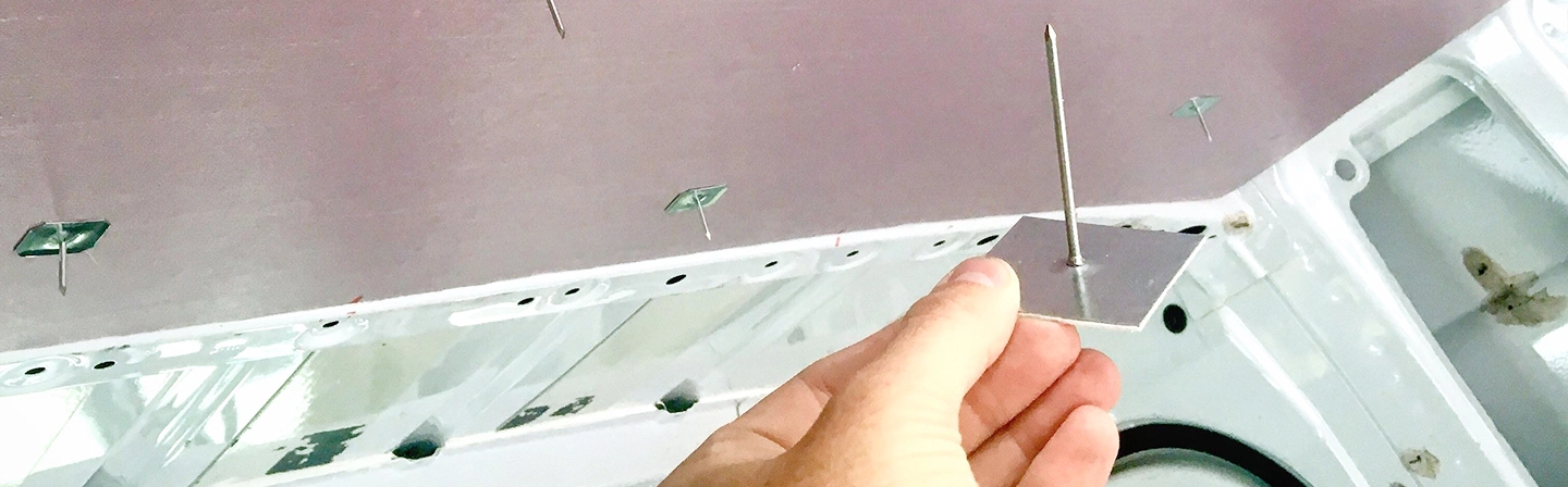 Stickpin fastener held before insulation installation and stickpin insulation by Express Drywall Services.