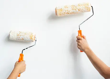 Two rollers used for commercial priming and painting by Express Drywall Services.