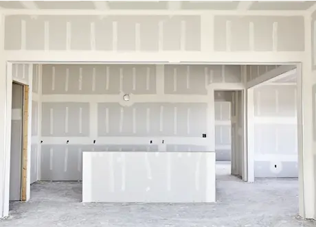 Framed entry and kitchen area after commercial fire-resistant drywall installation by Express Drywall Services.
