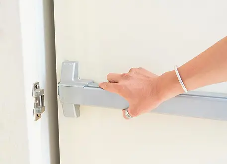 Emergency exit bar handle on commercial door