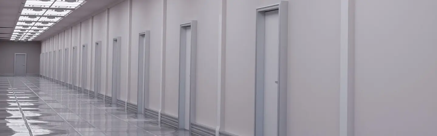 Interior hallway with multiple commercial metal doors by Express Drywall Services