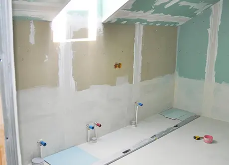 Commercial space under renovation with moisture-resistant drywall installation by Express Drywall Services.