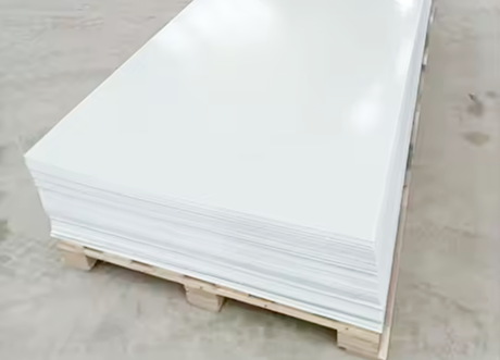 Stack of white FRP panels prepared for commercial installation