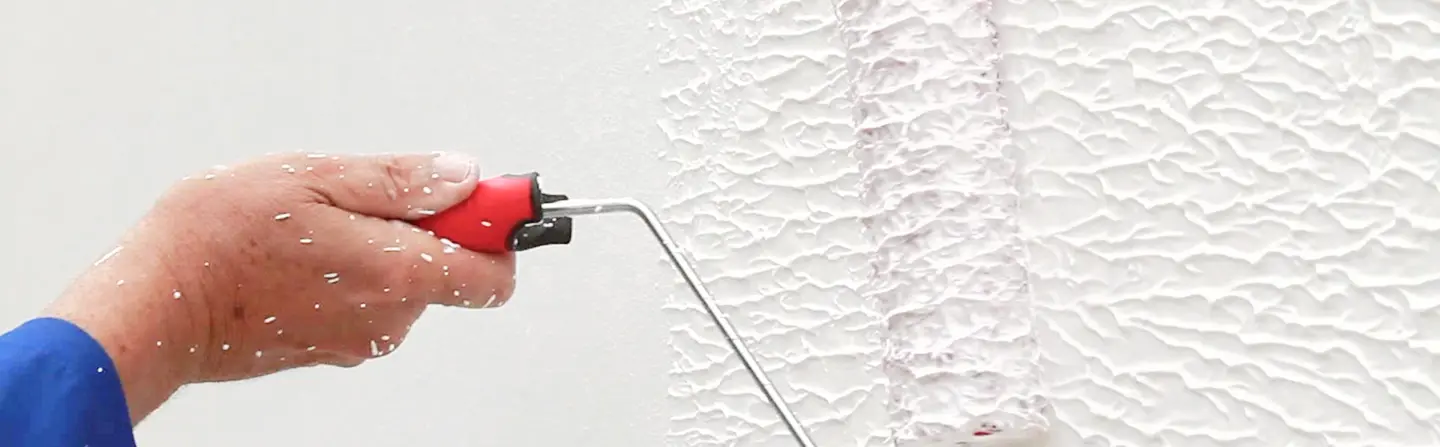 Applying orange peel texture with roller as part of Express Drywall Services texturing services