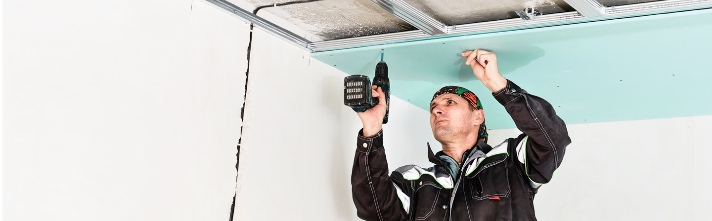 Ceiling panel being installed during residential drywall installation by Express Drywall Services.