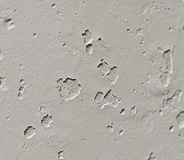 Surface imperfections shown on wall before residential drywall installation by Express Drywall Services.