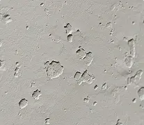 Surface imperfections shown on wall before residential drywall installation by Express Drywall Services.