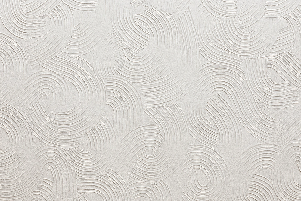 Swirled plaster texture detail from premium texturing services in Toronto by Drywall Express Services.