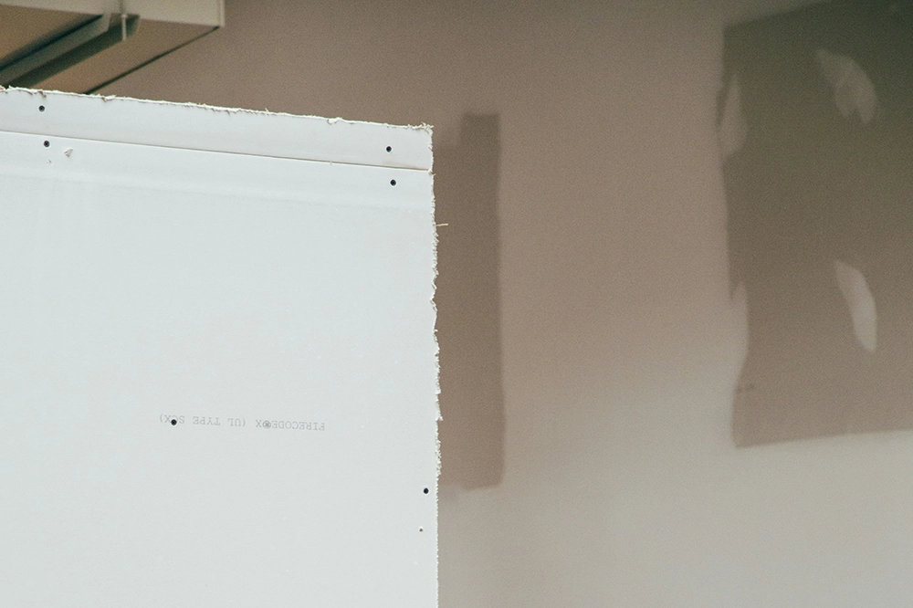 New drywall sheet prepared for taping and mudding services in Toronto by Drywall Express Services.