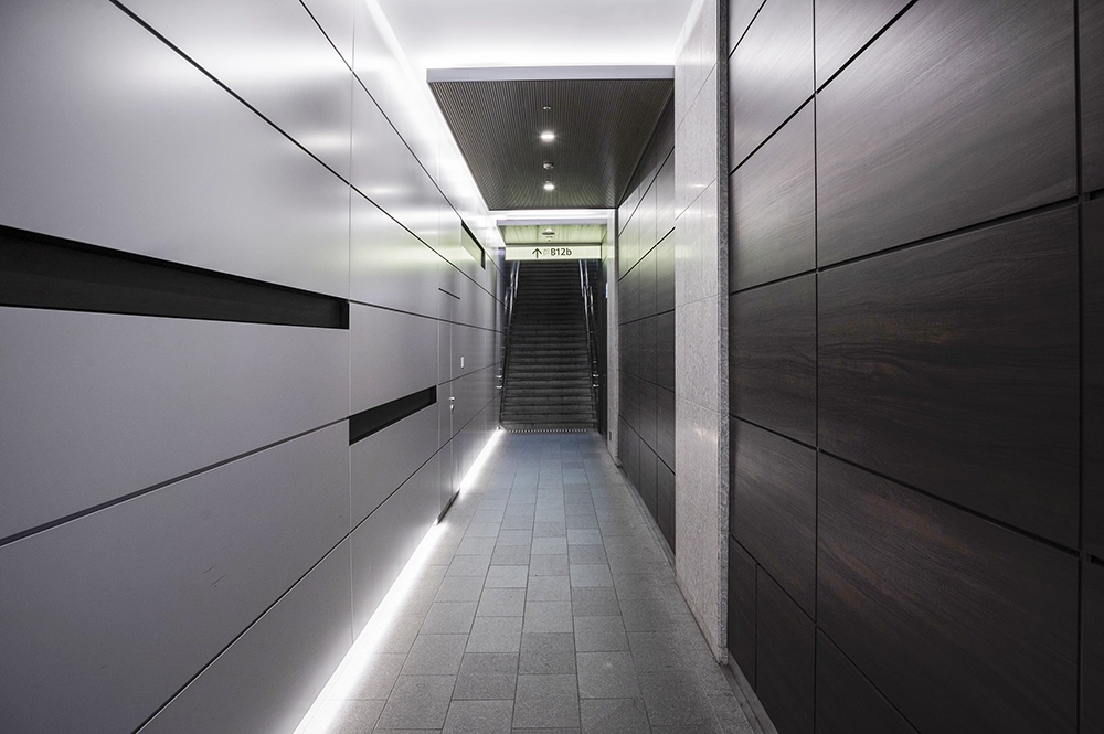 Minimalist underground passage with clean wall lines – example of fire and sound separation in Toronto by Drywall Express Services.