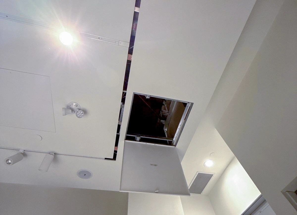 Open ceiling access door in a Toronto building – Express Drywall Services installation.