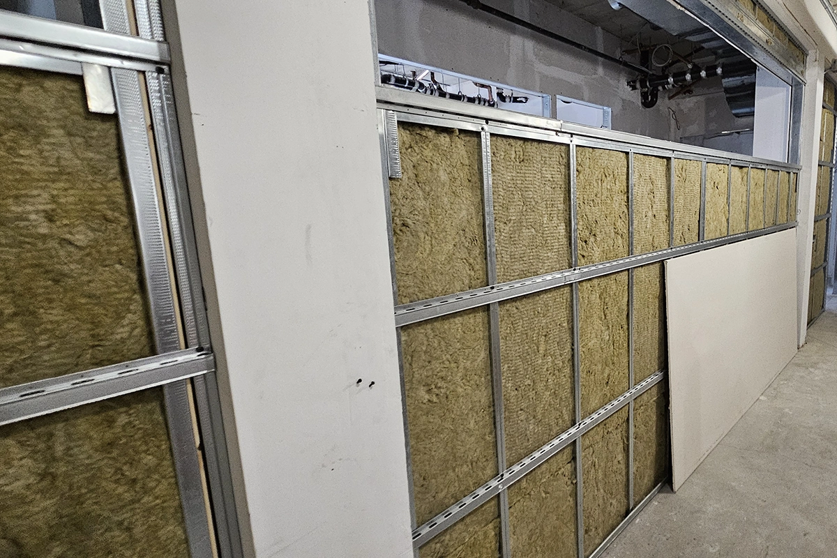 Wall assembly with insulation and resilient channel framing by Express Drywall Services in Toronto.