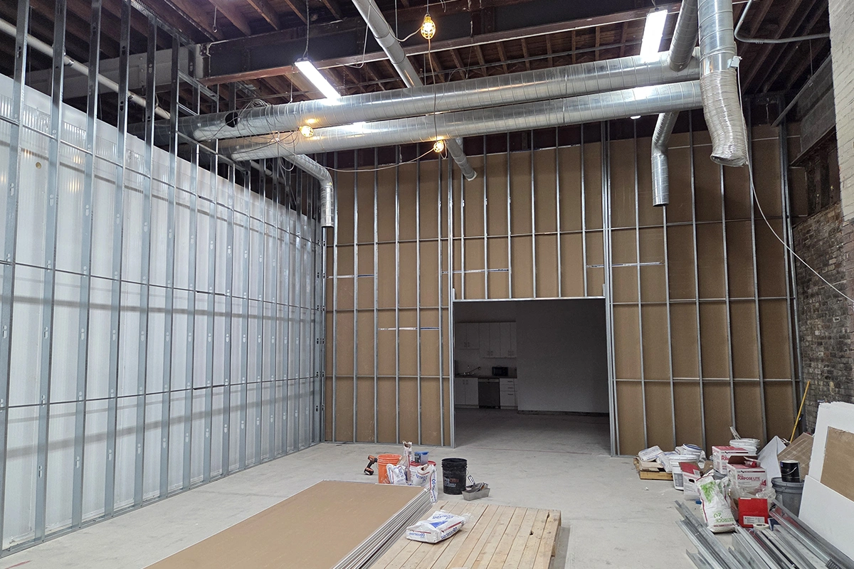 Large interior with framed partition walls and ceiling ductwork – Commercial Framing in Toronto by Express Drywall Services.