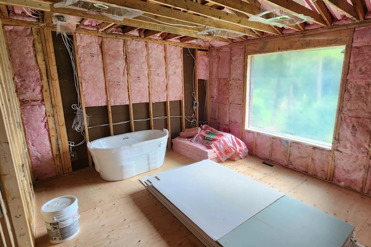 Bathroom under construction with materials ready for Commercial Insulation Installation and Stickpin Insulation in Toronto by Express Drywall Services.
