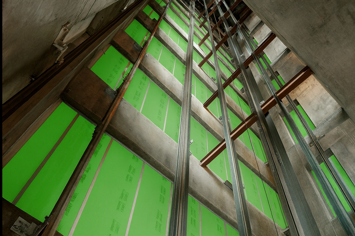 Shaft wall under construction with green panels installed by Express Drywall Services in Toronto.
