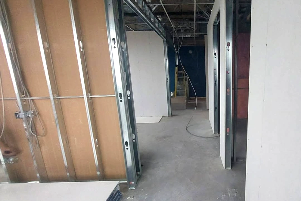 Exposed framing and drywall layout for Commercial Fire and Sound Separation in Toronto by Express Drywall Services.