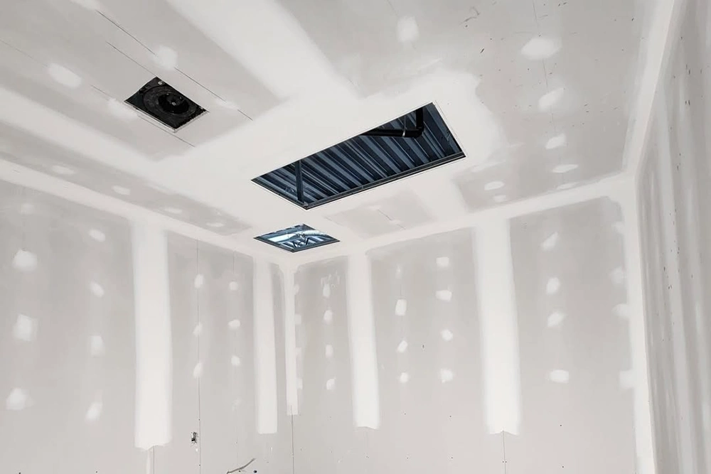 Unfinished drywall ceiling with access panel frame – Access Door Installation in Toronto by Express Drywall Services.