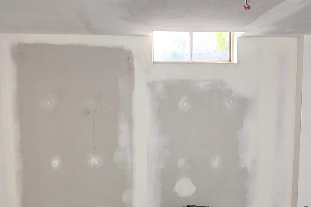Commercial drywall mudding around basement window – Commercial Drywall Taping and Mudding in Toronto by Express Drywall Services