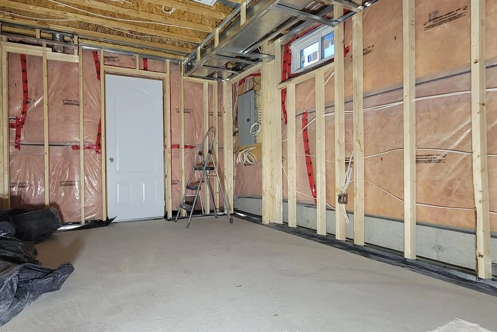 Basement project for Commercial Insulation Installation and Stickpin Insulation in Toronto by Express Drywall Services with visible framing and vapor barrier.
