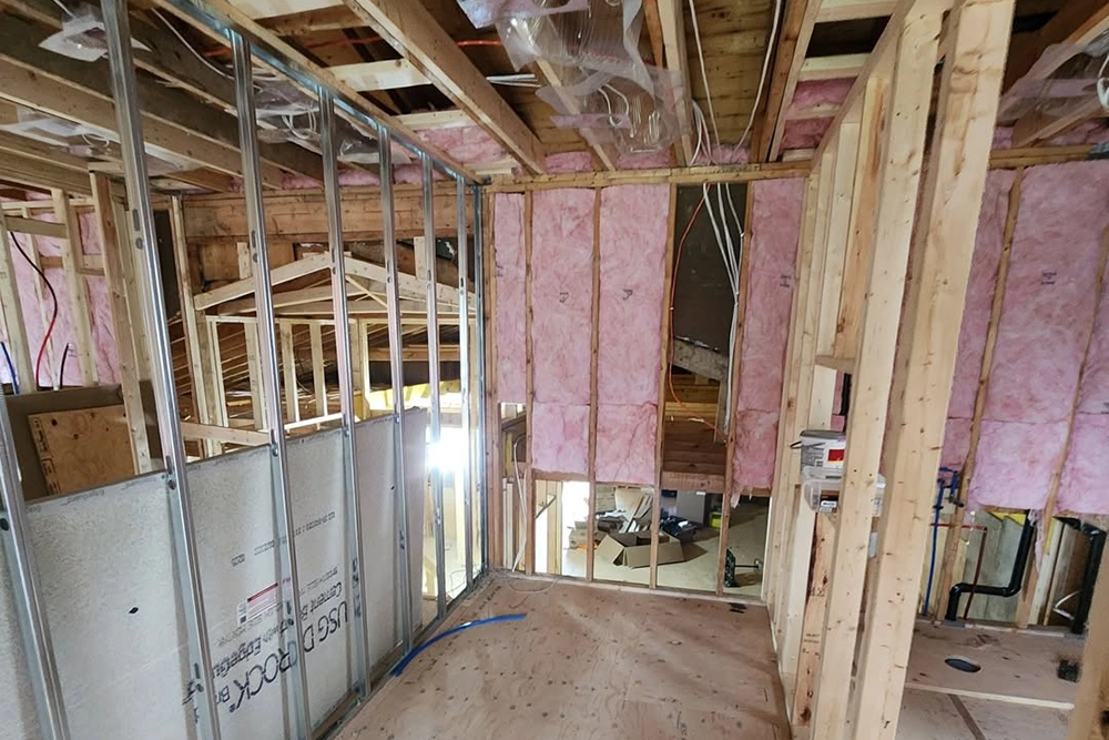 Residential structure with insulation batts in progress by Express Drywall Services for Commercial Insulation Installation and Stickpin Insulation in Toronto.