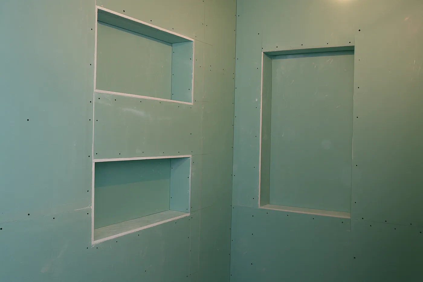 Installed moisture-resistant drywall with recessed niches during commercial moisture-resistant drywall installation in Richmond Hill.