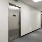 Hollow metal fire-rated door installed in a commercial building corridor in Ontario